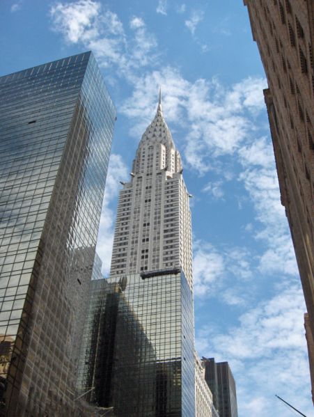 This photo looks up at the famous Chrysler Building in New York. Standing at an impressive 319&nbsp;metres (1,047&nbsp;ft) in height, the Chrysler Building was completed in May 1930. It features an Art Deco style of architecture and is widely thought of as being one of New York's most recognizable buildings.